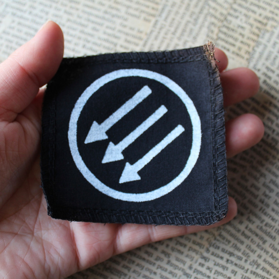 Three arrows - a small fabric badge