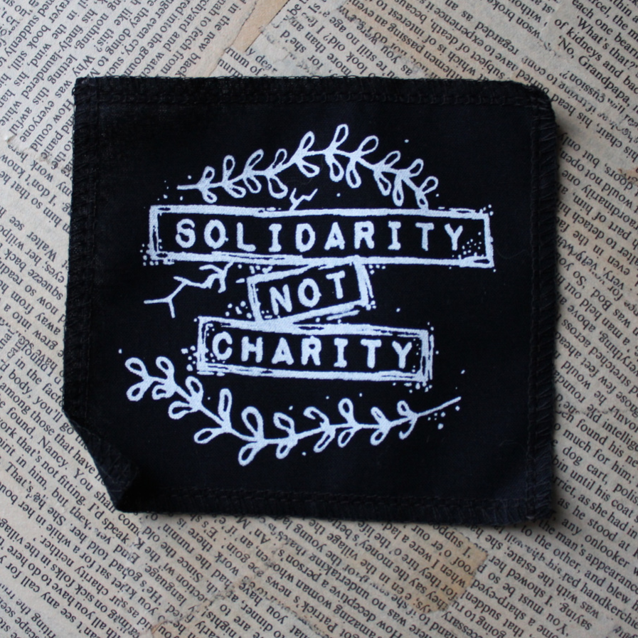 Solidarity not Charity - small fabric badge