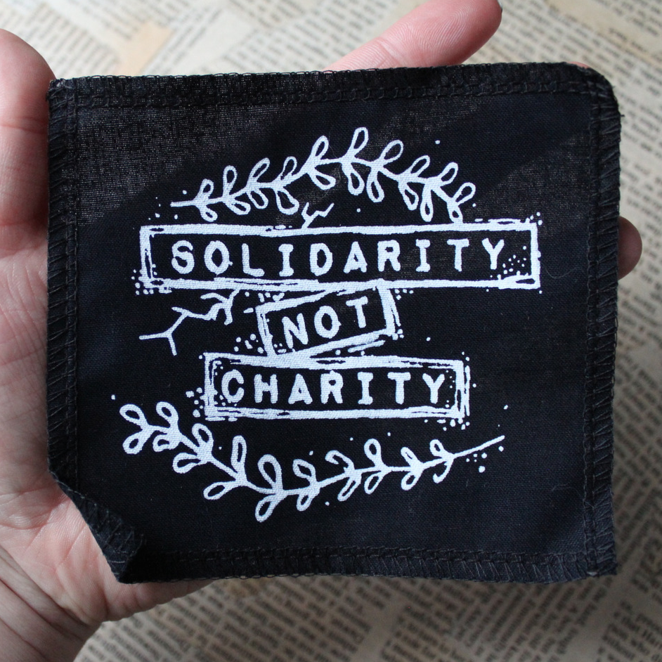 Solidarity not Charity - small fabric badge