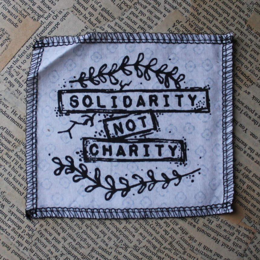 Solidarity not Charity - small fabric badge