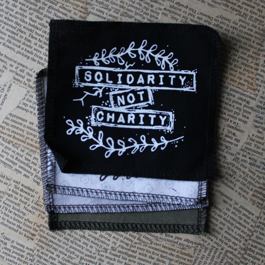 Solidarity not Charity - small fabric badge