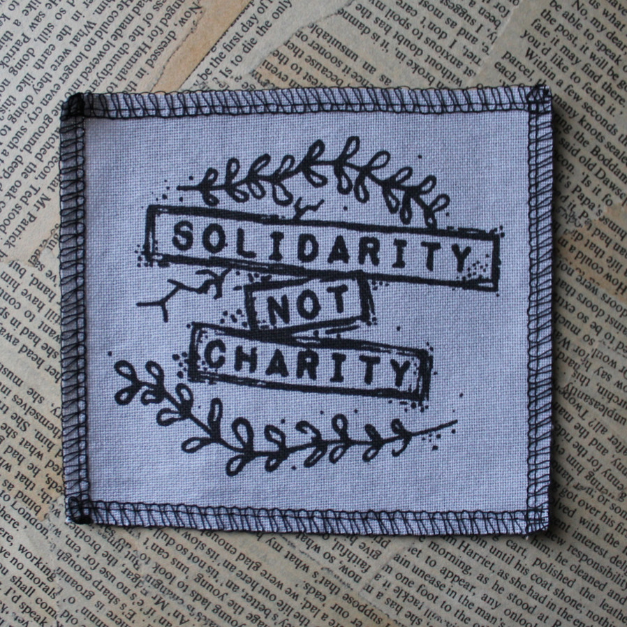 Solidarity not Charity - small fabric badge