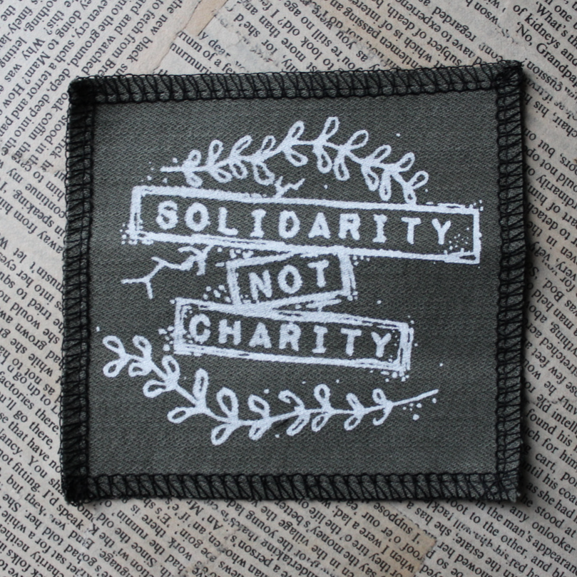 Solidarity not Charity - small fabric badge